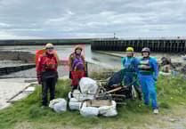 Kayakers clean the river Rheidol