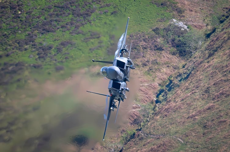 F-15 Eagle fighter jet. Stunning images shows a U.S. warplane zooming over Wales. Photographer David Robertshaw also shot a British Typhoon as it roared through Snowdonia last week. He says: "While camping near Dolgellau last week, I witnessed and photographed a breathtaking display of fast jet activity in one of the UKâs most iconic flight training areas. Against the rugged backdrop of Snowdonia, I captured rare close-range images of both the Eurofighter Typhoon and F-15 Eagle, two of the worldâs most powerful aircraft."
