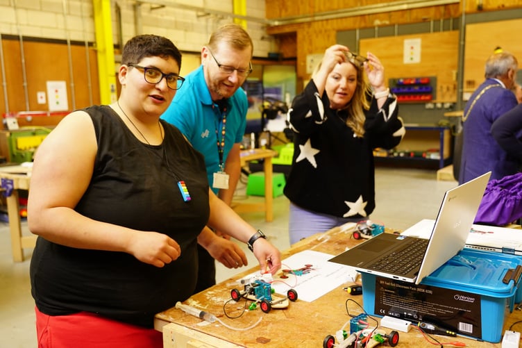 People building working model cars at the 2024 community fun day in Dolgellau