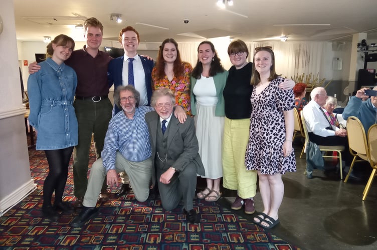 Several ACS student members with choir chair, Gareth Kelly, and musical director, David Russell Hulme