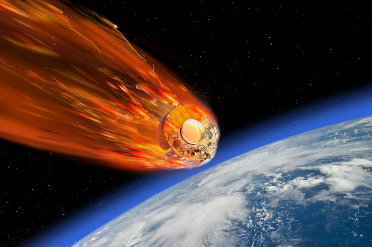 Artist impression of a satellite burning up as it travels through Earth's atmosphere.      An out of control Soviet spacecraft is set to crash into the Earth on Sunday morning - and it could hit the UK. Scientists had estimated the Cosmos-482, a Venus lander stranded in Earth orbit since 1972, was expected to make an uncontrolled reentry between 8-13 May. However, ESAâs Space Debris Office latest prediction Friday sees reentry of the descent craft taking place at 08:12 UK time on Sunday. The exact landing site is unknown, but the potential impact zone covers much of the globe between 52Â° north and 52Â° south latitude - which takes in the south of England and parts of Wales. The probeâs robust construction-designed to survive Venusâ harsh atmosphere-means some parts, especially the titanium descent capsule, may reach the surface intact. Space agencies are closely monitoring its descent, but most forecasts suggest it will likely fall into the ocean.