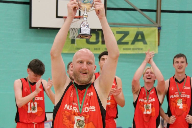 Warriors Captain Alan Gbel lifts the cup