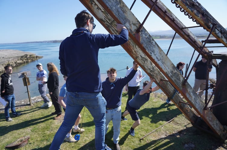 Students lifting one of the cranes at Caer Belan