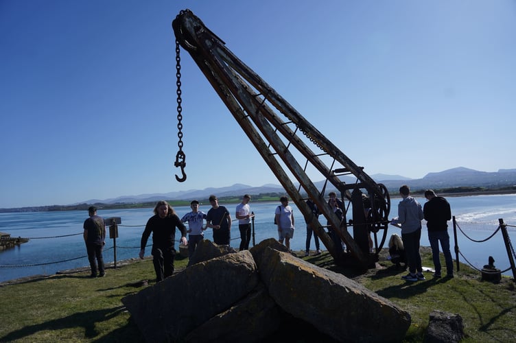Students with one of the cranes at Caer Belan
