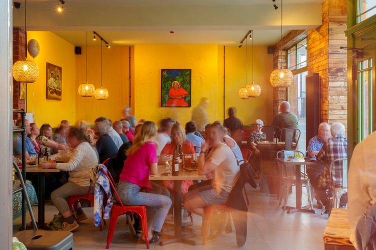 A portrait of Mama Fay watching over the new restaurant