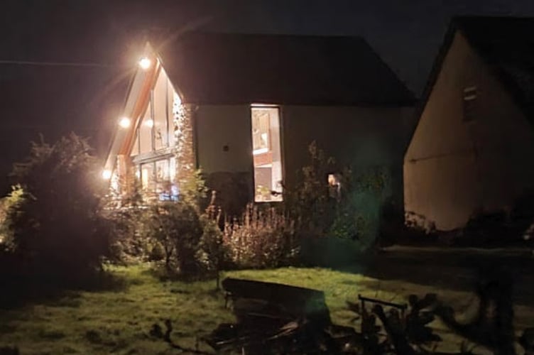 Plas Coch Barn lit up at night. Photo: Jean Williamson and Mick Sharp