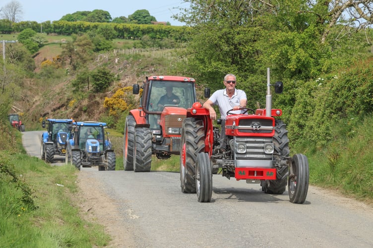 Dai John leads the bigger tractors.on his MF135