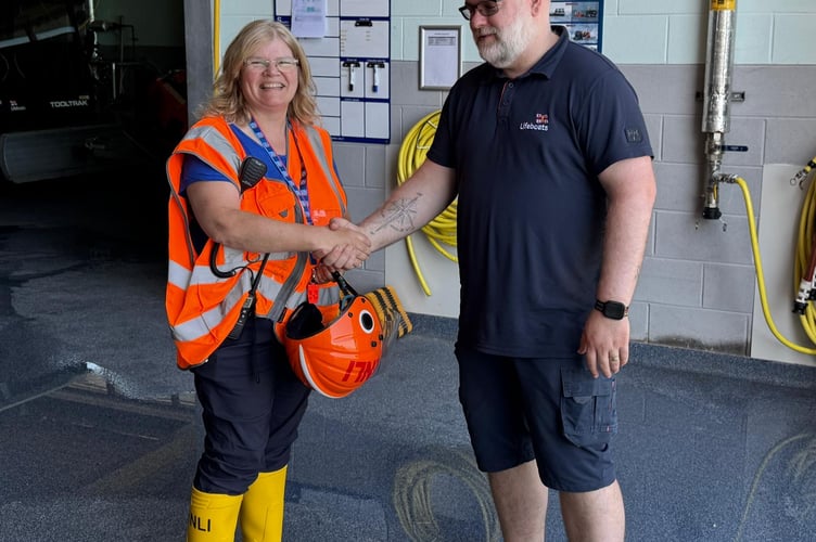 Caroline jones (left) with RNLI trainer assessor. Photo: Pwllheli RNLI
