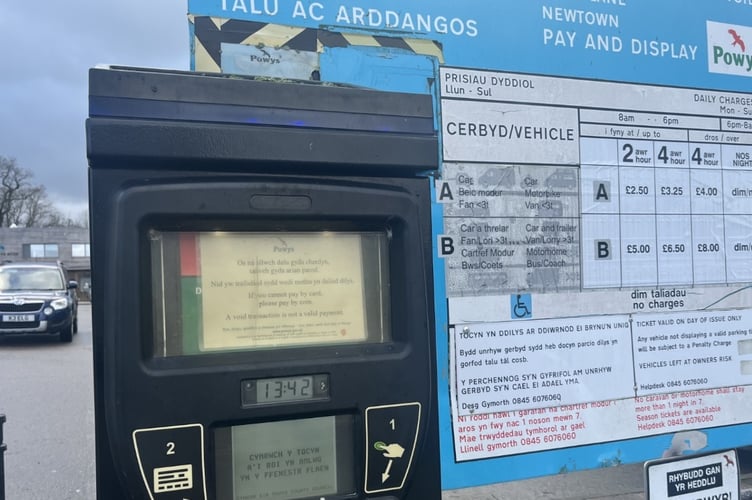 A councillor has called for an update on Powys car parking charges plan