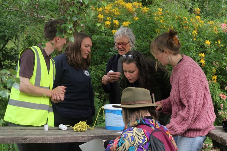 Volunteers learning about water testing with Jenny Lampard of Lab Dŵr Dyffryn Dyfi at the Centre for Alternative Technology