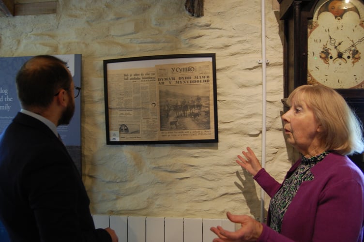 One of the Trust's volunteers Norma showing the Minister for Culture artefacts from the Arch family estate