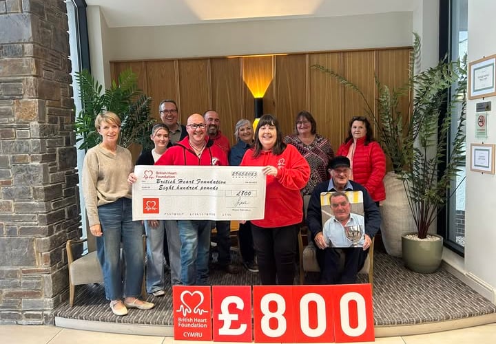 Arwyn Hughes' friends and family present BHF with £800 raised in his memory. Photo: BHF Cymru
