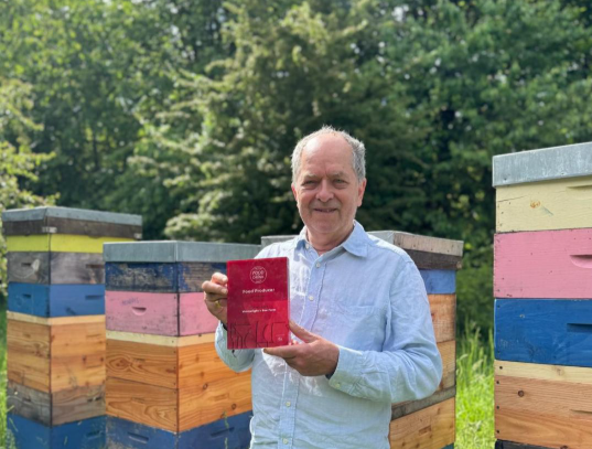 David Wainwright, co-founder and beekeeper at Wainwright’s Bee Farm, with the Food Producer of the Year award