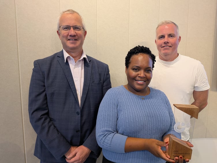 Aberystwyth University Vice-Chancellor Professor Jon Timmis, Race Equality Officer Sheree-Ann Jonas, holding the Race Equality Charter Bronze Award, and Diversity and Inclusion Manager Dylan Eurig Jones