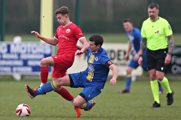 DENBIGH, DENBIGHSHIRE, WALES - 14th DECEMBER 2024 - Ilan Hughes of Llanuwchllyn tackles Sam Duffy of Denbigh during Denbigh Town vs CPD Llanuwchllyn in Round 4 of the FAW Welsh Cup at Central Park, Denbigh (Pic by Sam Eaden/FAW)
