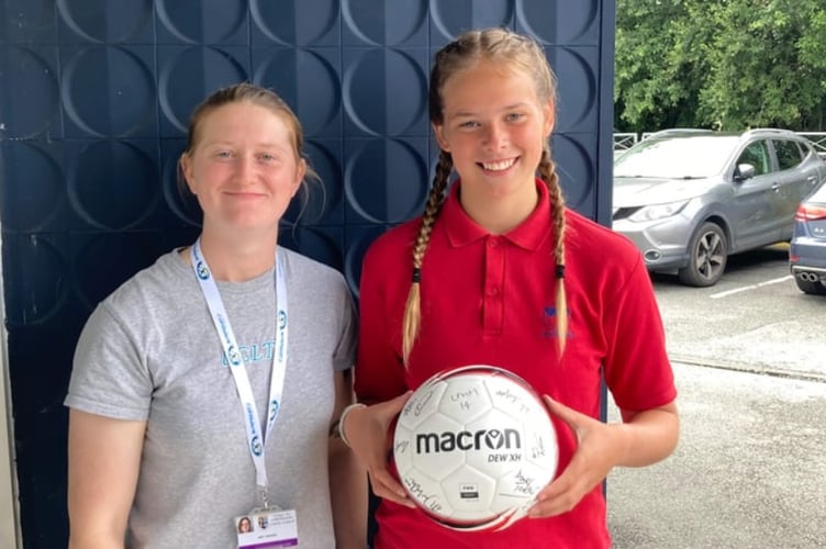 Katie pictured with Aberystwyth Town Women's Amy Jenkins who presented her with an award after winning a keepy-uppy competition organised by Ceredigion’s Youth Work and Engagement Team last year