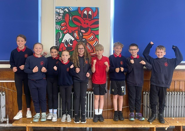 Ysgol Pen-y-bryn School Council celebrate securing the Welsh Language Charter Gold Award
