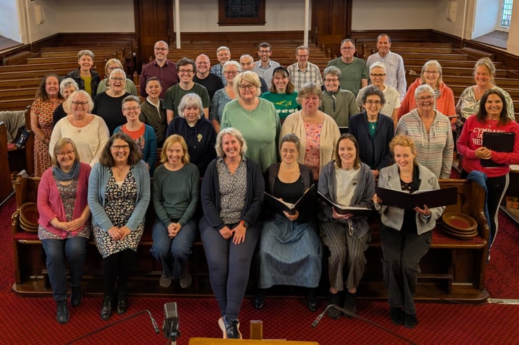 Conductor Louise Amery, centre, with Côr ABC
