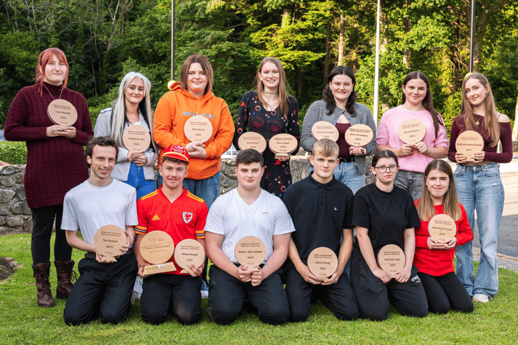 The winners of Coleg Meirion-Dwyfor’s 2024/25 Achievers’ Awards with their trophies. Student of the Year Olivia Boyd, is back row, centre