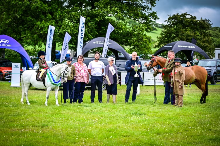 Left: Tomi Jac and Bengad Desert Sage, Jean Evans, Show Chairperson, Llinos Spenser, Show President and Representatives of Sinclair Group, headline sponsors for 2026 Right: Jonathan Hughes-Jones with Ardenhall Ellenisia. Photo: Celfach Photography