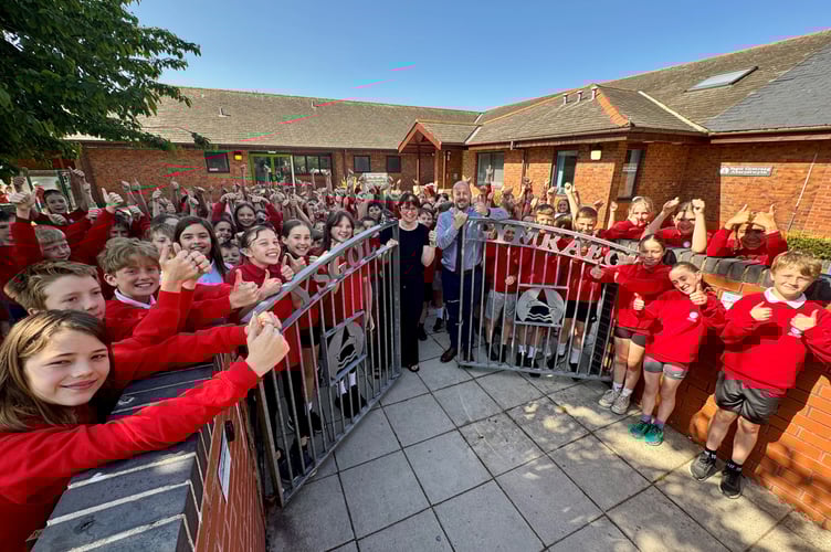 Ysgol Gymraeg Aberystwyth headteacher Gareth James and deputy headteacher Caryl Jones with some of the pupils from Ysgol Gymraeg