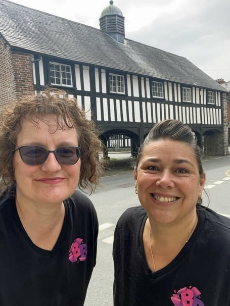 Beyond Breakout founders Jo Woodall (left) and Lorna Morris with the Old Market Hall, Llanidloes in the background.