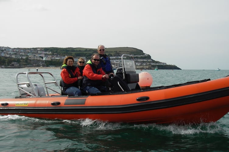 Stephen Wood aboard a powerboat