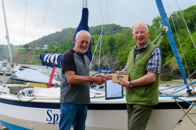 Stephen Wood (right) receives his RYA Cymru Wales Impact Award from Cardigan Bay Watersports Centre Principal Crawford McLeary