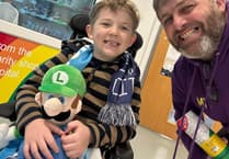 Swimming coach to take on charity walk to thank Lewis' carers