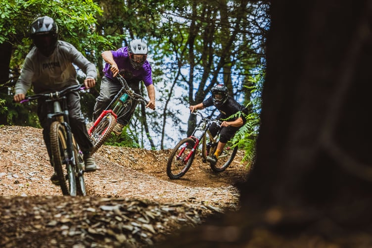 Riders make their way down the new trail