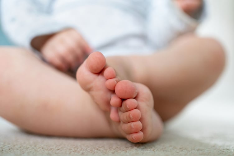 File photo dated 04/08/23 of a baby plays with toys at home in Northamptonshire. Ministers have launched a review of parental leave and pay as the current system is "not working" for young families. Issue date: Tuesday July 1, 2025.