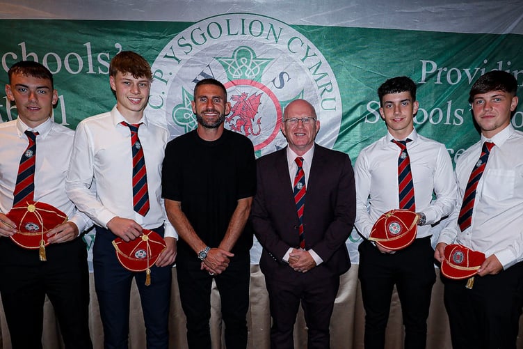 Osian Morris, Rhys Williams, Morgan Davies and Byron Davis with their Welsh Schools caps, with Angel Rangel and Marc Lloyd Williams