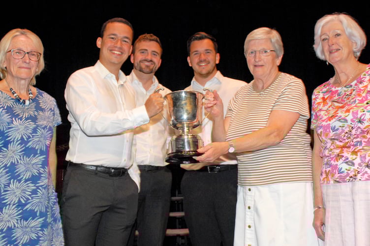 Members of Cor Dydd receive the Choir of the Festival award