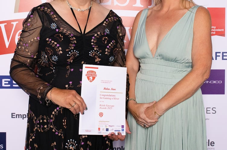 Helen Neve (left), receiving her award from Liz Wright, from sponsor Porters Estate Agents, of Bridgend