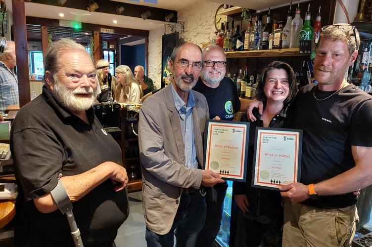  Angharad and Paul Hywel-Jacobs at the Rhos Yr Hafod being presented with the awards for West Wales CAMRA pub of the year and cider pub of the year by Steve Brady, West Wales CAMRA Area Organiser, supported by Chris Charters, CAMRA Wales Director (left), and John Gale, Bae Ceredigion CAMRA Chair (centre)