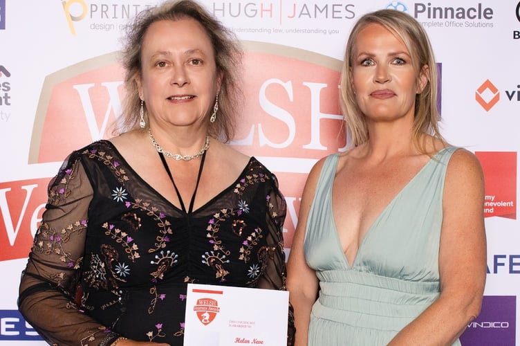 Helen Neve (left), receiving her award from Liz Wright, from sponsor Porters Estate Agents, of Bridgend