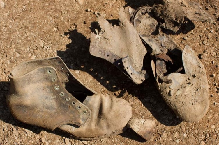 Suspected post-World War II era military issue boots recovered during excavation at Penrhos Polish Village. Photo: Gwynedd Council
