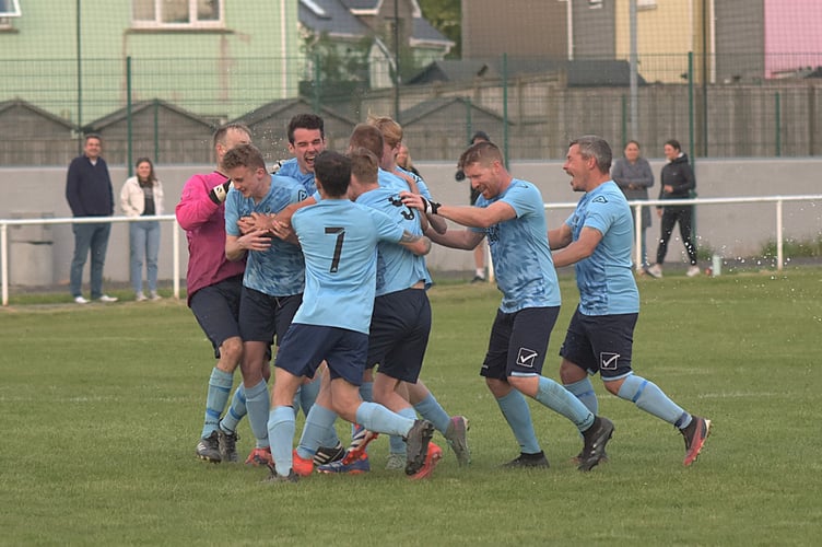 Borth players celebrate after winning the penalty shoot-out