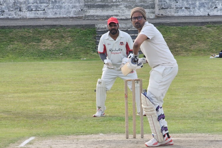 Lahiru Chamil takes guard, watched by Sumesh Antony