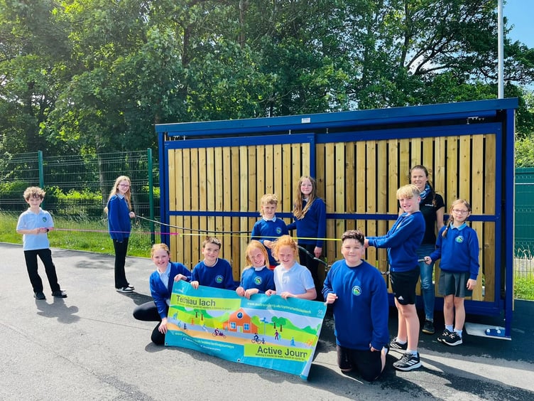Ysgol Treferthyr pupils with the new bike shelters. Photo: Gwynedd Council