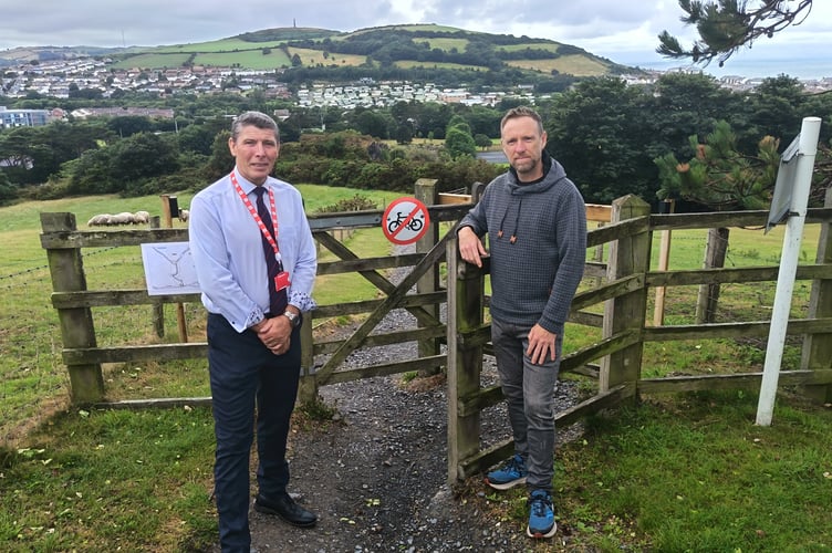 Mark Stevens and Councillor Shelley Childs next to one of the gates on the NLW path which will be removed as part of works to improve walking and cycling access on this route.