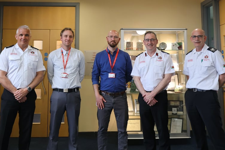 Pictured from left to right: MAWWFRS Head of Operational Response Ashley Hopkins, British Red Cross Emergency Response Operations Manager for Wales Laurie Wynne, British Red Cross UK Community Resilience Lead Henry Barnes, MAWWFRS Chief Fire Officer Roger Thomas and MAWWFRS Corporate Head of Training and Development Geraint Thomas