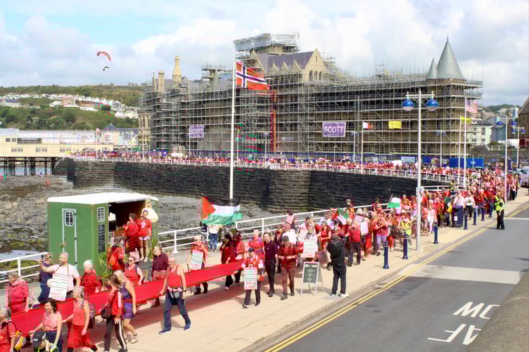 On 26 July the Red Line protest came to Aberystwyth. An estimated 1,200 people joined the march in solidarity with the Palestinian people, the 'Red Line' created with a 500m banner to symbolise "the red lines that have been crossed in Gaza"