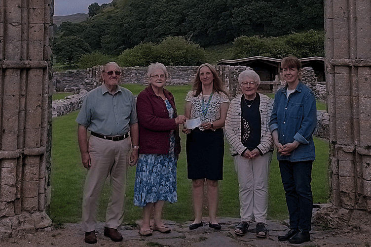 Mrs Stella Dart receives a cheque on behalf of the Wales Air Ambulance from representatives of the chapels and churches of Pontrhydfendigaid, Ystrad Meurig and Swyddffynnon