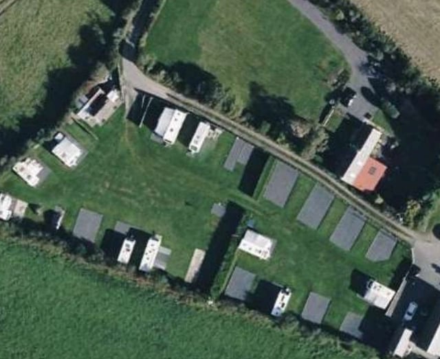 Camp site operated “without benefit” of planning permission