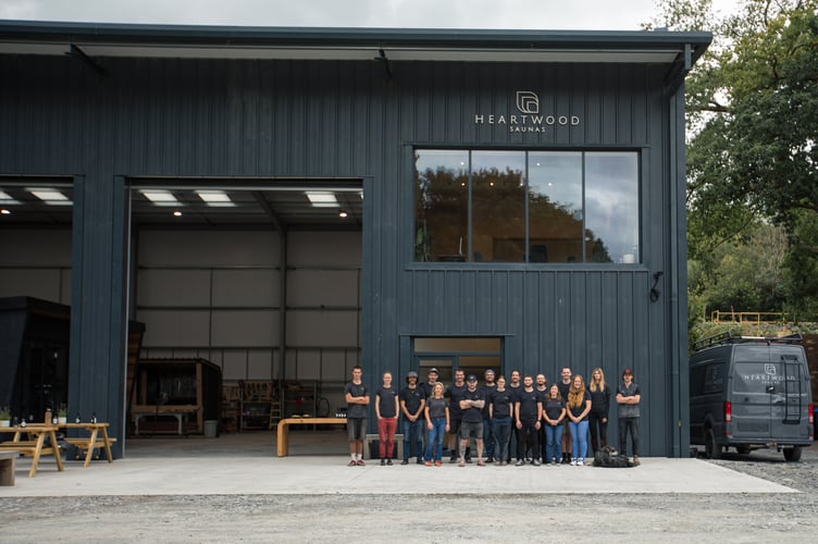 Olly Davey, founder of Heartwood Saunas, with his team at their new purpose-built workshop in Glantwymyn. Photo: Nils Bussink