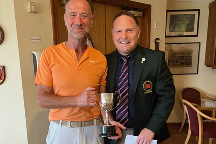 Club Champion Alan Shaw being presented with the Willis Cup by Nick Downing Captain