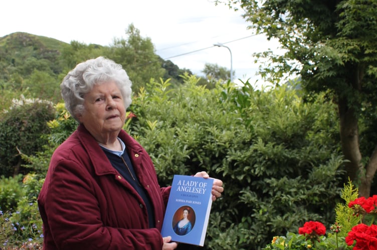 Author Sophia Pari-Jones with a copy of her book