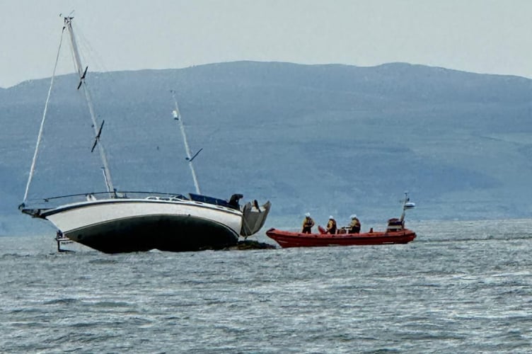 Abersoch RNLI rescued two people and a dog after their yacht ran aground on Carreg y Trai. Photo: Abersoch RNLI