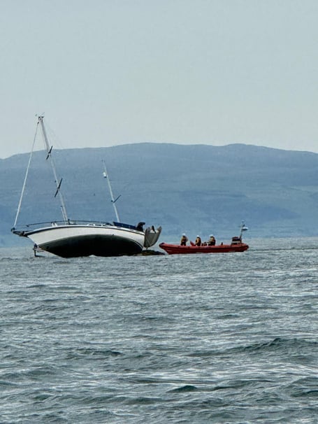 Abersoch RNLI rescued two people and a dog after their yacht ran aground on Carreg y Trai. Photo: Abersoch RNLI